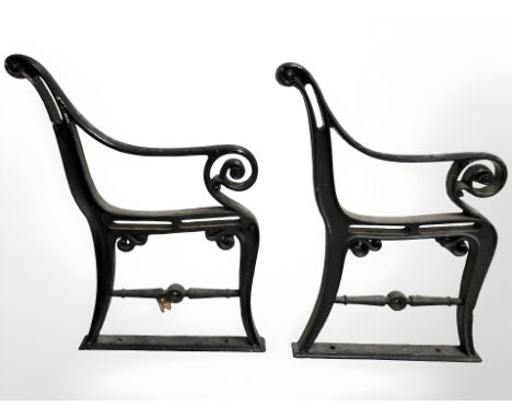 A pair of painted cast iron bench ends.