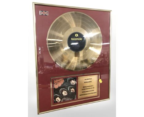 A The Beatles Rubber Soul gold plated limited edition vinyl disc, in frame, 51 cm x 41 cm.