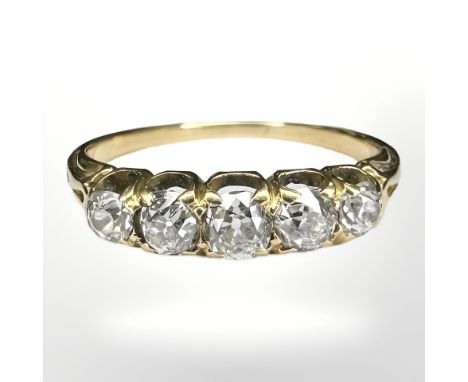 An 18ct gold five stone old-cut diamond ring, the total diamond weight estimated at 0.85 carat, size R. CONDITION REPORT: 3.4
