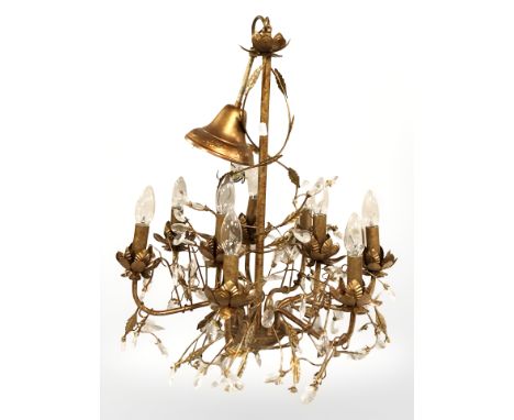A decorative gilt metal chandelier with glass droplets 
