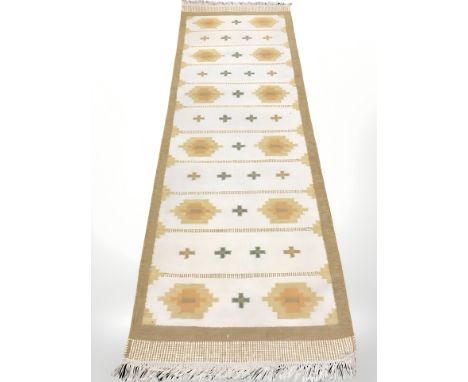 A flatweave Kilim runner, 260 cm x 82 cm.