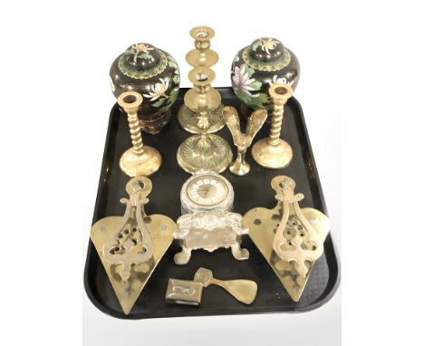 A group of brass candlesticks, trivet stands, pair of Chinese cloisonne enamel ginger jars on wooden bases, mantel timepiece,