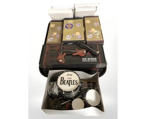 A miniature The Beatles drum kit and a quantity of Atlas Editions miniature electric guitars, Axe Heaven miniature guitars, e