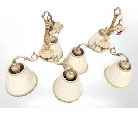 A pair of gilt metal three sconce ceiling light fixtures, height 52 cm excluding fitting.