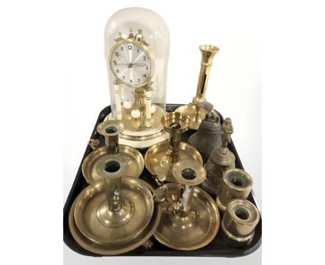 An anniversary clock under dome, several chamber sticks, bells, etc.