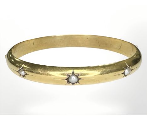 A cultured pearl hinged bangle, inner width diameter 5.5cm CONDITION REPORT: Unmarked. 13.9g