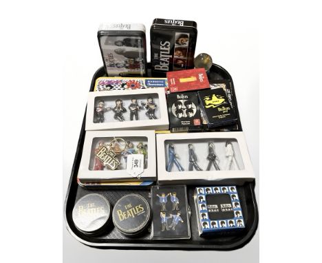 The Beatles - A group of figurines, playing cards, cufflinks, lapel badges, etc.