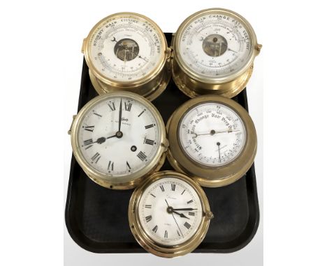 A group of brass cased ship's instruments including a Schatz barometer and a similar timepiece, etc. 