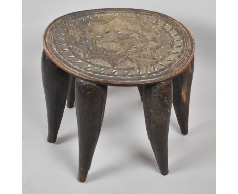 A Late 19th/Early 20th Century African Carved Hardwood Nupe Stool/Table Having Six Trunk Legs, the Top Carved with Sunburst D