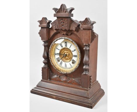 An Early 20th Century American Mantle Clock in the Gingerbread Style with Movement by Ansonia, New York, 38cm high 