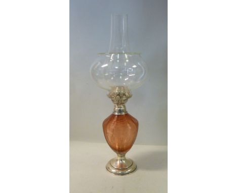 A late Victorian silver mounted ruby glass oil lamp, the reservoir of ovoid ribbed form, on a pedestal foot  JD WD Sheffield 