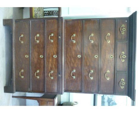 A George III mahogany chest-on-chest, having a dentil moulded cornice, over three in-line drawers and two long drawers, above