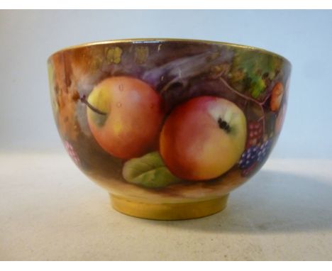 A Royal Worcester china bowl with a gilded interior, decorated with soft fruit, on a naturalistic ground  bears the signature