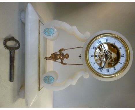 A late 19thC French mantel timepiece of drum, design, the white alabaster case raised on scrolled supports; the partially exp