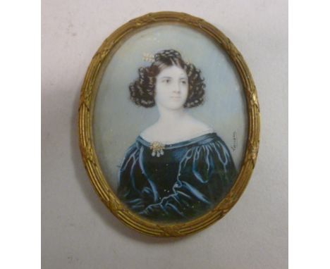 Late 19thC British School - a miniature head and shoulders portrait, a young woman with her hair in ringlets, wearing a blue 