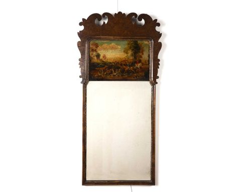 Walnut fret wall mirror18th Century style, inset with a painted hunting scene, 99.5cm x 48cmSmall loss to the parcel gilt and