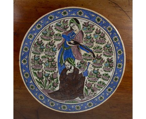 Qajar circular panelIran, late 19th/early 20th Centurydecorated in polychrome enamels on a white ground, depicting a women to