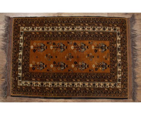 Red ground rugAfghanistan, with elephant foot designs and with a banded border, 186cm x 127cmWith some light wear.