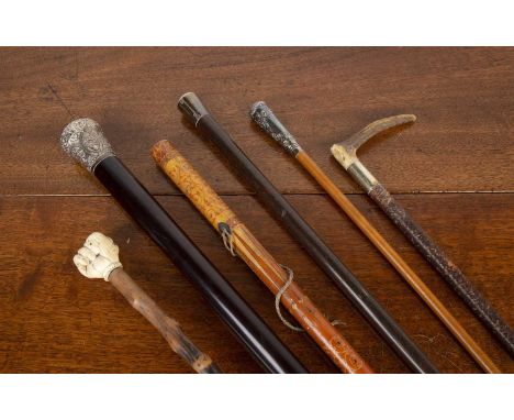 Collection of Victorian and later walking canesand riding crops, comprising of: a Sinhalese example, with lacquered decoratio