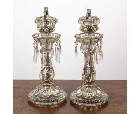 Pair of glass lustresclear moulded glass with enamel painted decoration, with later modifications to use as electric table la