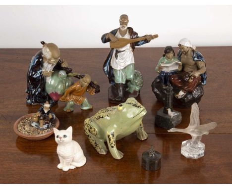 Group of piecesincluding four Chinese Shiwan type figures, largest 23cm, a serpentine miniature lighthouse, 12cm, a serpentin