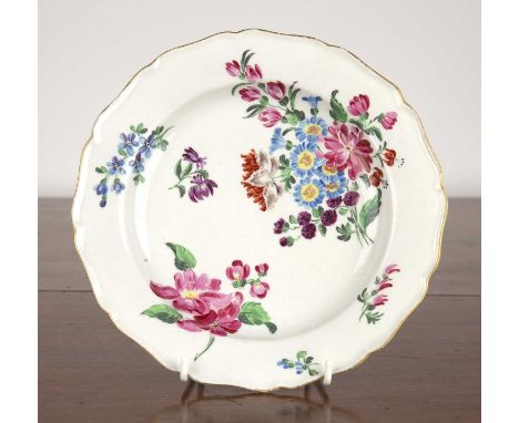 Porcelain plate, probably Worcestercirca 1780, painted with sprays of flowers, within a gilt border, 22.5cm diameterSome firi