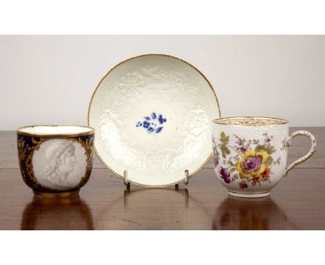 Meissen blue ground porcelain cup19th Century, decorated with an en grisaille portrait, 6cm high, together with a Berlin porc