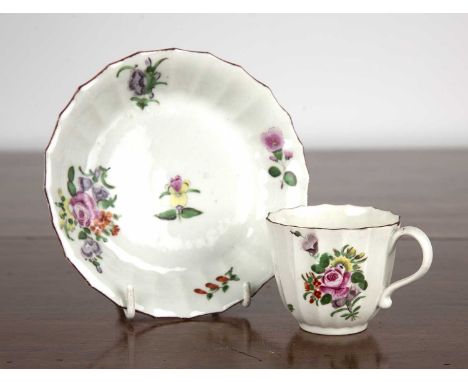 Worcester coffee cup and saucercirca 1770, of fluted form and painted with sprays of flowers, with pseudo Chinese underglaze 