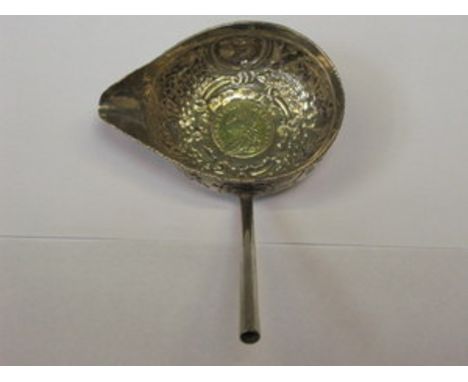 SILVER COLOURED LADLE WITH MOUNTED GOLD COLOURED COIN, HANDLE DEFICIENT 