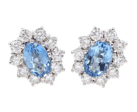 Pair of 18ct white gold oval aquamarine and diamond cluster stud earrings, hallmarked, total aquamarine weight approx 1.55 ca