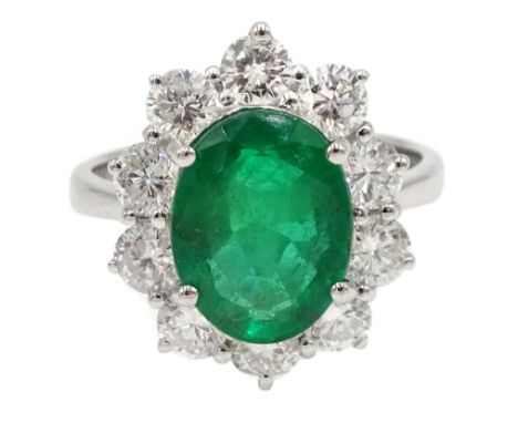 18ct white gold oval emerald and diamond cluster ring, stamped 750, emerald approx 2.85 carat, total diamond weight approx 1.