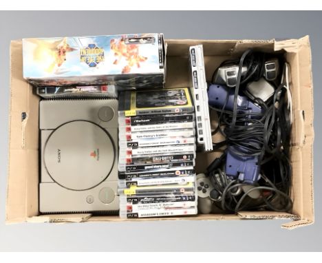 A Sony Playstation 1 console, a Playstation 2 slim console, various Playstation 3 games, controllers, etc. (1 box)