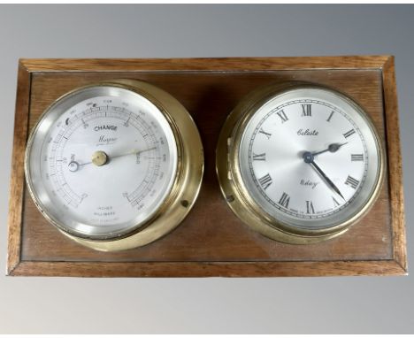 A brass cased barometer and eight day timepiece mounted on board, width 26 cm.