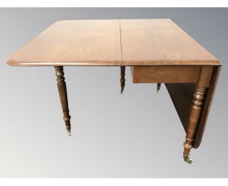 A mahogany drop leaf gate leg table, width 107 cm.