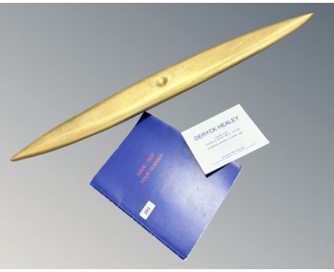 Deryck Healey : A gilded bronze elliptical wall art piece, with hanging bracket verso, length 91 cm, signed DH '90 verso and 