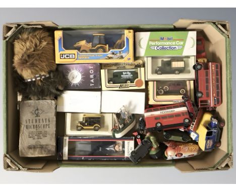A group of boxed and unboxed die case vehicles including Lledo, vintage student microscope, etc. (1 box)