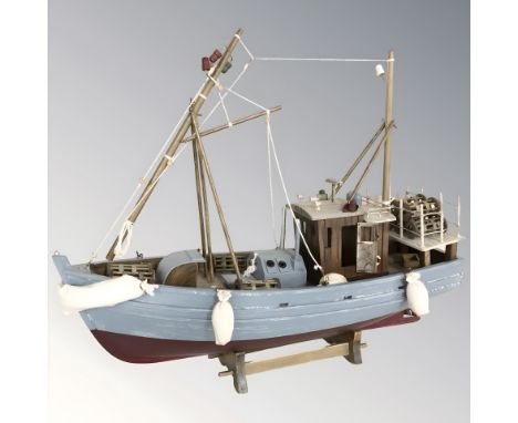 A wooden scale model of a trawler, length 45 cm.