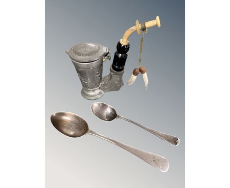 Two silver spoons and a German pewter pipe. CONDITION REPORT: Spoons: 35.4g.