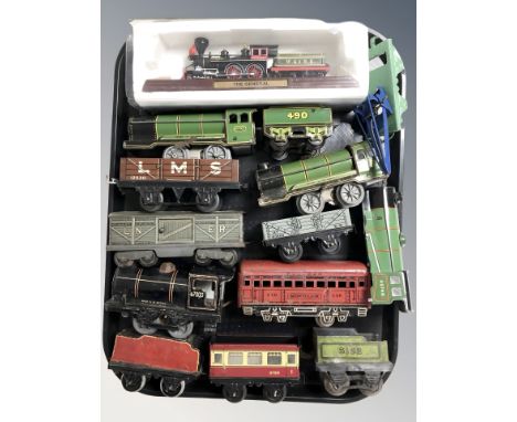 A group of vintage tin plate rolling stock, further scale model of the locomotive The General 