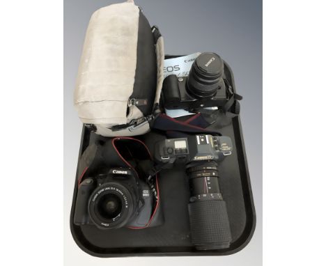 A Canon EOS600D digital camera with Canon 18-55mm lens, a further Canon EOS500 camera with 35-80mm lens and a Canon T70 camer