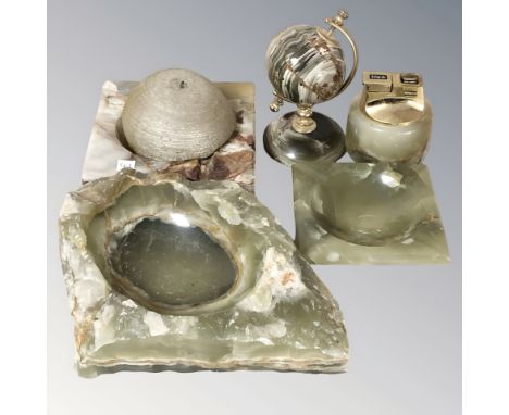 A group of onyx items including table lighter, miniature globe, ash trays, etc.