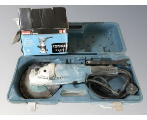 A Makita GA9020 disk saw, in box, and a further boxed Makita trimmer.