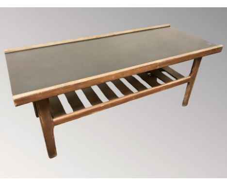 A 20th century teak and melamine rectangular coffee table with under shelf, length 112 cm  