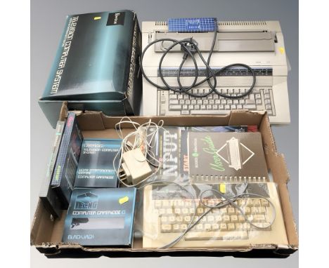 A vintage television computer system, Acorn and Xerox keyboards, computer cartridges and other similar items. (1 box)