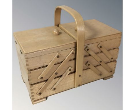 A concertina sewing box, width 33 cm.