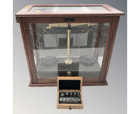A set of Griffin & Tatlock scales, in case (glass as found), together with a smaller set of precision weights.