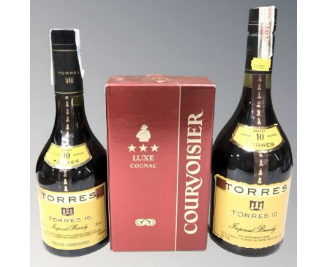 A bottle of Courvoisier Luxe cognac, 50cl, in carton, and two bottles of Torres 10 Imperial brandy, 1l and 70cl. (3)