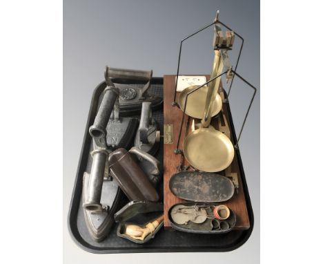 A group of irons, a leather cigar case, a Meerschaum pipe in the form of a hand clasping a goblet, a small set of opium scale