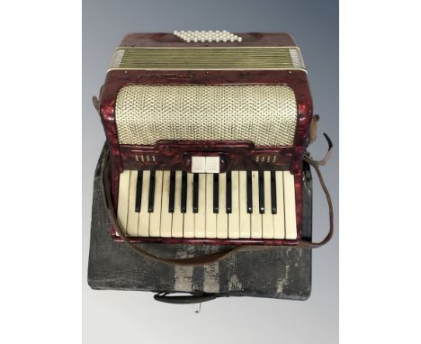 A vintage Italian piano accordion in carry case.