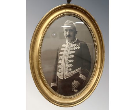 A gilt framed portrait photograph of a figure in military dress, overall 58 cm x 45 cm 
